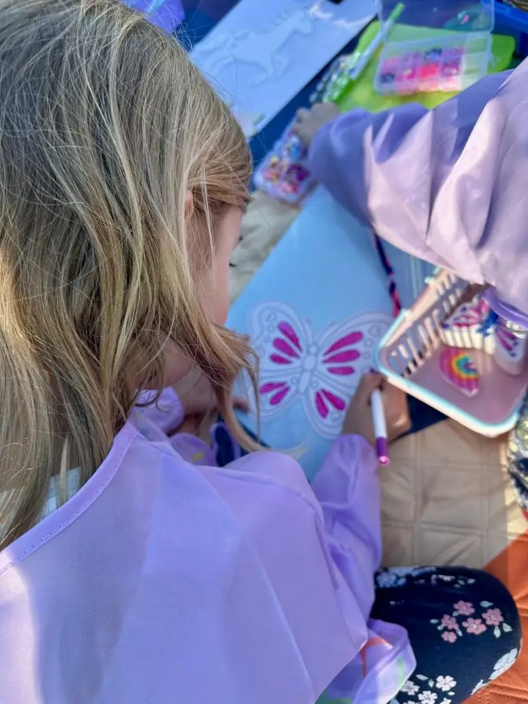 children doing craft activities in the park with Aunty Em